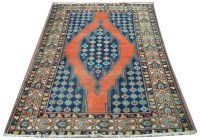 Lot 1114 - A Mazlegan rug, the diamond shaped medallion...