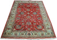 Lot 1116 - A Tabriz carpet, the red field decorated with...