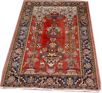 Lot 1134 - A Kashan prayer rug, decorated with a vase of...