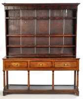 Lot 1204 - An 18th Century oak dresser, the delft rack...