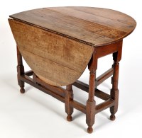 Lot 1219 - An 18th Century oak oval drop leaf dining...