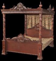 Lot 1233 - A 20th Century stained hard wood four poster...