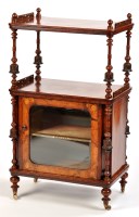 Lot 1235 - A Victorian inlaid figured walnut whatnot, the...