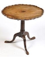 Lot 1245 - A tip-up-top occasional table, the shaped...