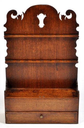 Lot 1250 - A late 18th Century spoon rack, the pierced...