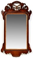 Lot 1268 - A George III mahogany parcel gilt wall mirror,...