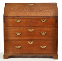 Lot 1270 - A George III oak bureau, the fall-flap...