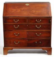 Lot 1295 - A George III mahogany bureau, the fall flap...