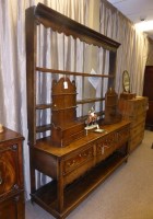 Lot 1330 - An 18th Century oak dresser, the delft rack...