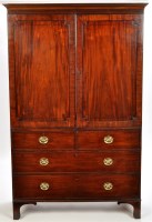 Lot 1339 - A George III gentleman's mahogany wardrobe,...