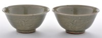 Lot 521 - Near pair of Yaozhou celadon type stoneware...