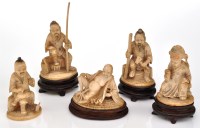 Lot 596 - Five Chinese carved ivory seated or squatting...