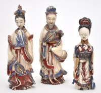 Lot 606 - Three Chinese carved painted ivory snuff...