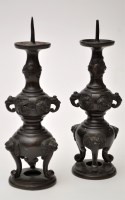 Lot 641 - Pair of Japanese bronze pricket candlesticks,...