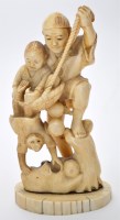 Lot 646 - A carved Japanese bone figure of a man,...