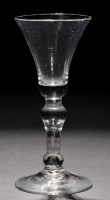 Lot 659 - Baluster wine glass, the waisted bowl with a...