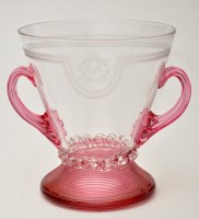 Lot 670 - Engraved rose and clear glass two-handled vase,...