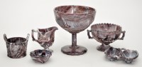 Lot 693 - Six pieces of milky purple marbled glass of...