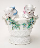 Lot 745 - Bone china basket, with two cats leaning out...