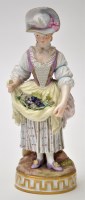 Lot 787 - Porcelain female figure of a vine harvester,...