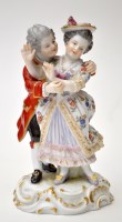 Lot 788 - Porcelain figure of a frolicking couple, both...