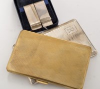 Lot 887 - Two Elizabeth II engine turned money clips; a...