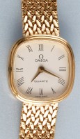 Lot 929 - Omega: a lady's 9ct. gold quartz wristwatch,...