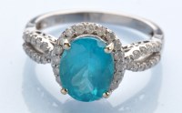 Lot 945 - An apatite and diamond cluster ring, the oval...