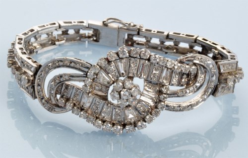 Lot 961 - A diamond bracelet, set throughout with...