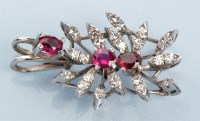 Lot 963 - A ruby and diamond pendant, set with three...