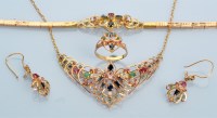 Lot 965 - A parure set with diamonds, rubies, emeralds...