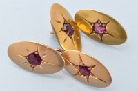 Lot 968 - A pair of yellow metal and ruby set cufflinks,...