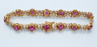 Lot 972 - A ruby and diamond bracelet, each circular...