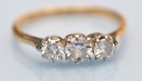 Lot 991 - A three stone diamond ring, the graduated...