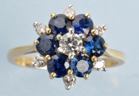 Lot 996 - A sapphire and diamond cluster ring, the...