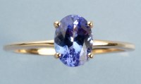 Lot 1001 - A tanzanite ring, the oval facet-cut tanzanite...