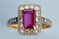 Lot 1005 - A ruby and diamond cluster ring, the baguette...