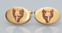 Lot 1031 - A pair of 9ct yellow gold cufflinks, decorated...