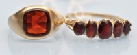 Lot 1037 - A garnet signet ring, within collet setting on...