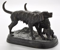 Lot 1203 - A patinated bronze model of two dogs, standing...