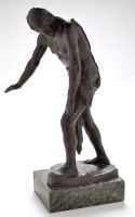Lot 1204 - A reproduction patinated bronze model of a...
