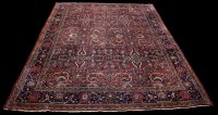 Lot 1219 - A Farrahan carpet, the claret ground filled...