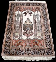 Lot 1221 - A part silk prayer rug, the field decorated...