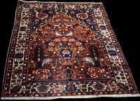 Lot 1226 - A Bakhitari prayer rug, with central urn...