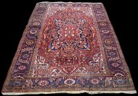 Lot 1229 - A Heriz carpet, with geometric floral...