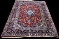 Lot 1231 - A Kashan, the red ground decorated with floral...