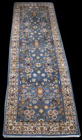 Lot 1250 - A Sarough runner, with floral scrolling design...