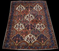 Lot 1257 - A Bakhtiari rug, with geometric floral design...