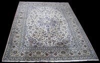 Lot 1260 - A modern Kashan carpet, the blue coloured...