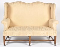 Lot 1299 - A Georgian style wing settee, the serpentine...